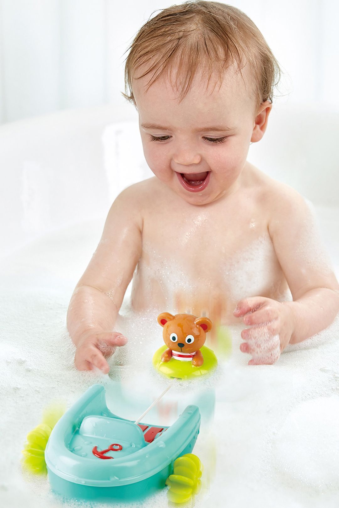 Купить Игрушка для купания мишка на тюбинге HAPE