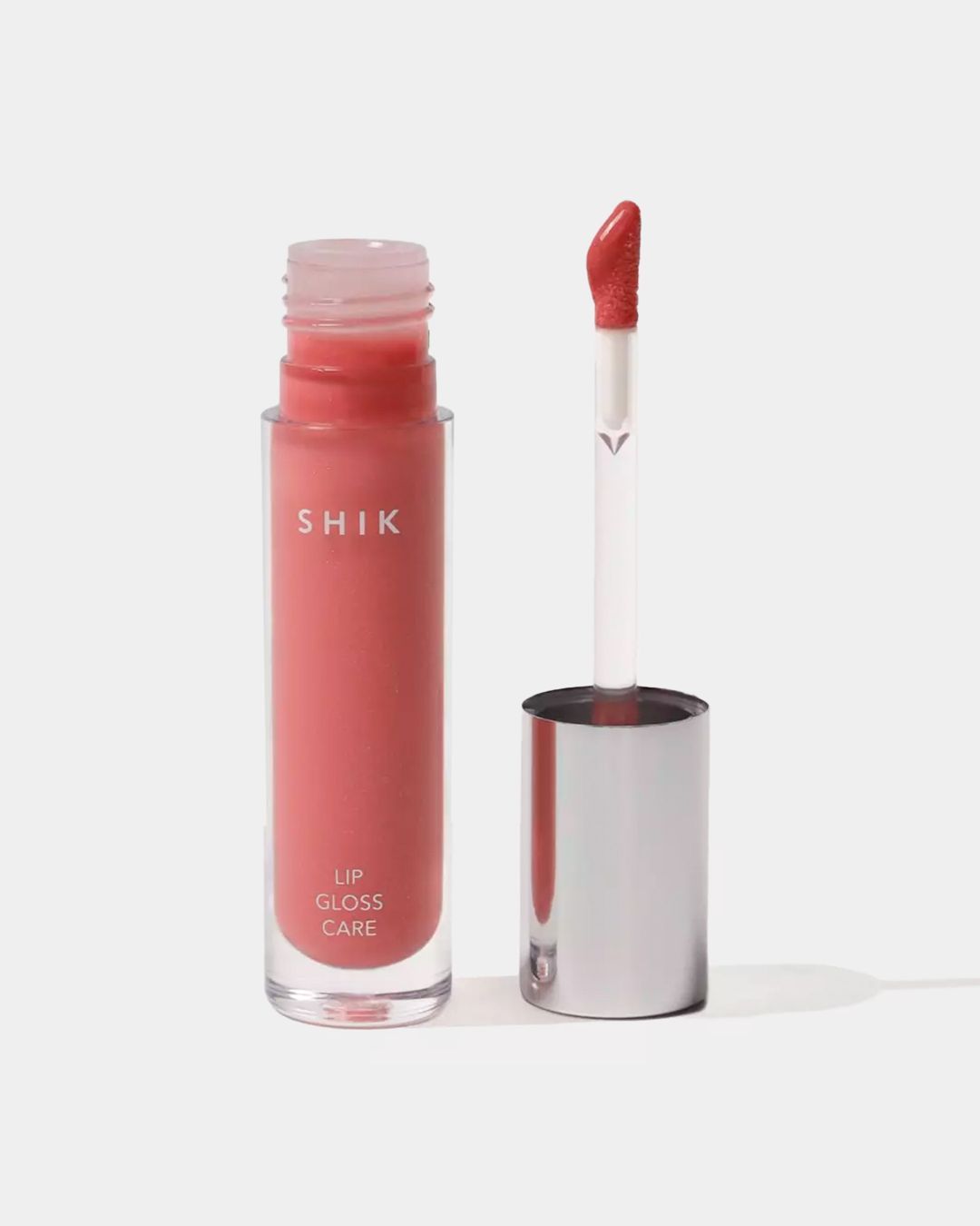 Купить Блеск для губ ухаживающий intense 01 pale pink SHIK